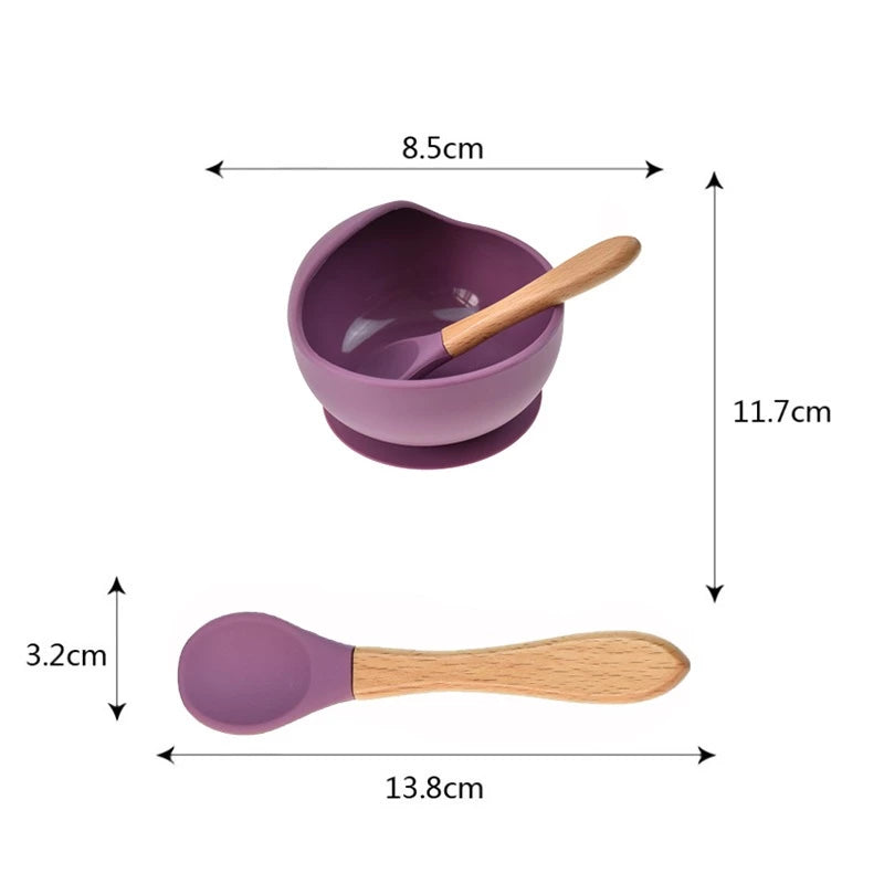 Silicone domed baby bowl set with wooden spoon for easy self-feeding, suction cup base sticks to the table without worrying about spilling