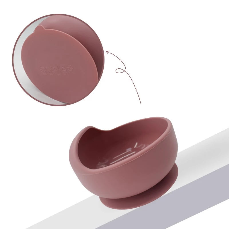 Silicone domed baby bowl set with wooden spoon for easy self-feeding, suction cup base sticks to the table without worrying about spilling